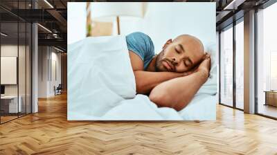 Relax, sleeping and man in bed, home and wellness with peace, comfortable or happiness. Male person, African or guy in a bedroom, healthy rest or dreaming with comfort, sleepy or tired with a blanket Wall mural