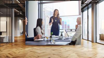 Shes taking the lead in this presentation. Cropped shot of a businesswoman giving a presentation in a boardroom. Wall mural