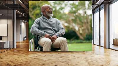 Taking in the views. Cropped shot of a handsome senior man sitting in his wheelchair outside. Wall mural