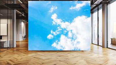 Simple beautiful gloomy blue sky with fluffy clouds in summer morning peace day as a background. Gray, white and turquoise color blurred skyline texture photography. Wall mural