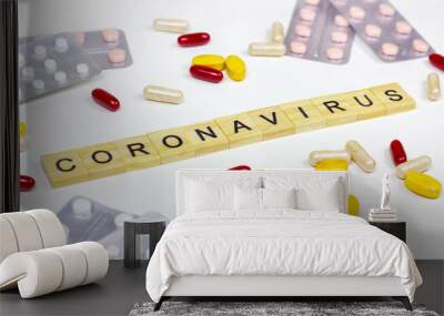 The medical phrase coronavirus with pills, capsules and tablets on light background. Ncov epidemic alert concept. Wall mural