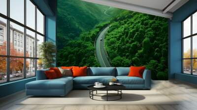 Aerial view of dark green forest road and white electric car Natural landscape and elevated roads Adventure travel and transportation and environmental protection concept Wall mural