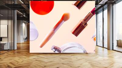 bottom view of a set of cosmetics made of lipstick, brushes, face oil, hand cream, perfume bottle. The background is for illustrating cosmetics. The concept of what's in a woman's bag. Wall mural