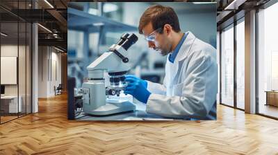 A laboratory technician examines a biological sample under a microscope. Biology and chemistry lab concept. Wall mural