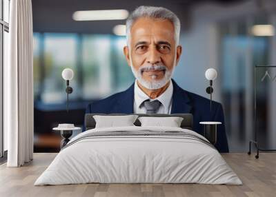 Senior indian business man smiling at the camera. Portrait of confident happy older man in a suit smiling at camera. Business concept, men at work. Wall mural