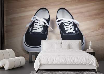 Black sports shoes. Modern teenage footwear. Wall mural