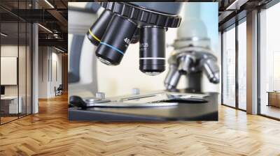 Professional microscope close-up with chemist scientific researcher hands using microscope in the laboratory interior. Wall mural