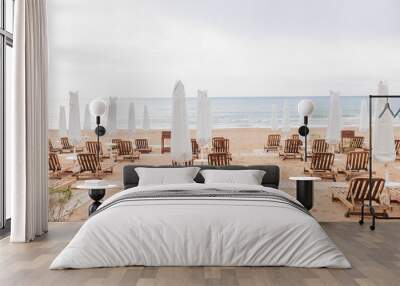 Sun loungers on the beach by the sea , the first line of the spa resort luxury hotel  Wall mural