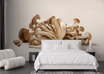 Fresh raw brown poplar mushrooms or velvet pioppini mushrooms on beige closeup Wall mural