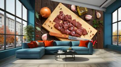 Raw beef liver with spices, herbs  and vegetables Wall mural