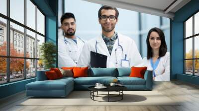 A view of a happy medical team of doctors, man and women Wall mural