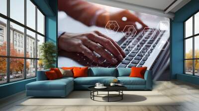 Close-up of male hands using laptop at office Wall mural