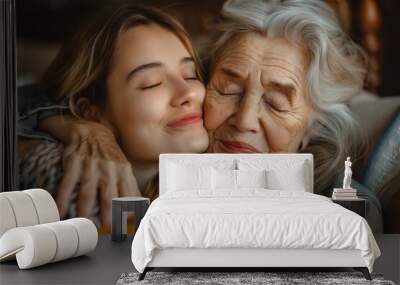 Close up portrait of a cute little girl hugging her grandmother at home. Mother's day Wall mural