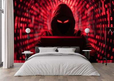 Hacker in hoodie sitting in front of computer monitor with binary code Wall mural