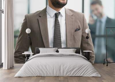 portrait of confident businessman with arms crossed in office Wall mural