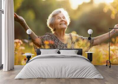 Portrait of a beautiful elderly woman against the background of nature. The concept of active old age. Support for the elderly. A happy pensioner. Beautiful natural aging Wall mural