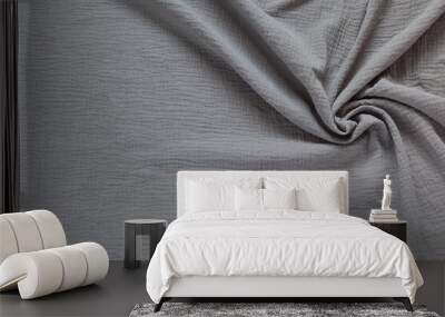 Stylish cotton wrinkled muslin fabric. Gray textile background. Base for sewing breathable, light, fashionable clothes. Empty space for text. Flat lay, close-up, top view, copy space, mock up Wall mural