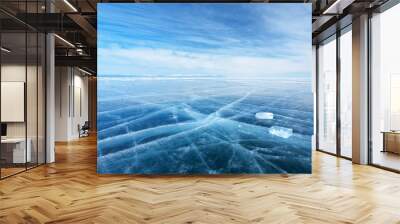 winter landscape of frozen baikal lake. the endless fields of smooth blue ice and two transparent ic Wall mural