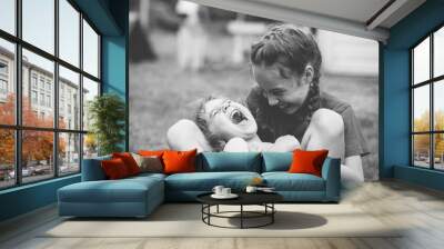 Two Happy little girls laughing and hugging at the  summer park. Black and white photo Wall mural