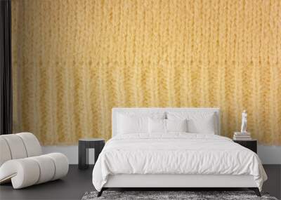 Yellow knitted woolen jersey fabric, sweater, pullover texture with edge isolated on white, transparent background. Fabric abstract backdrop, cloth wallpaper Wall mural