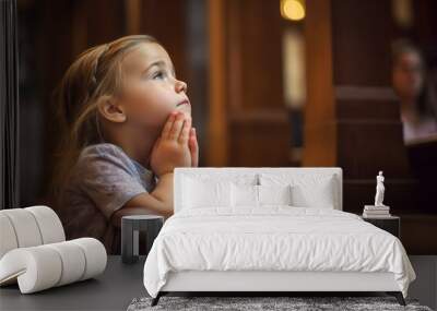 Little girl praying to god in church. Faith in religion and belief in God. Power of hope or love and devotion. Wall mural