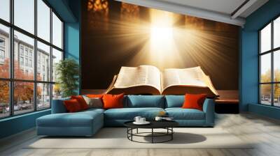 Open Holy bible book with glowing lights in church Wall mural