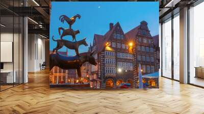 Famous statue of The Bremen Town Musicians, donkey, dog, cat and cockerel, from Grimm's famous fairy tale in the center of Old Town near Bremen City Hall, Bremen, Germany Wall mural