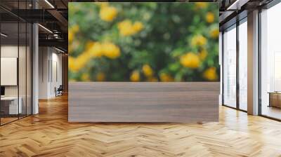 Abstract blurred green bokeh and brown wooden tabletop texture perspective counter for advertising product on display  and promoting  advertising product Wall mural