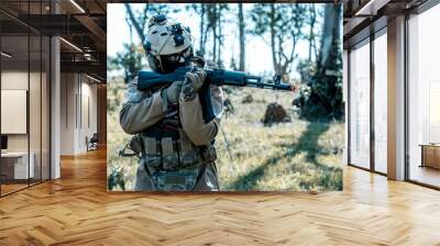 Anonymous soldier with AK-47 in the middle of the battlefield Wall mural