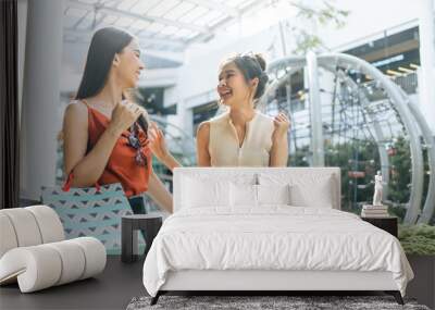 Asian beautiful two women shopping goods outdoor in department store.  Wall mural