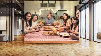 Portrait of Asian big family having dinner party in the kitchen. Wall mural