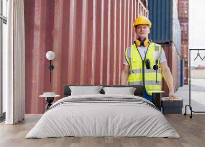 Portrait of Caucasian man worker working in container port terminal.  Wall mural