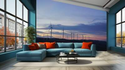 Beautiful landscape wind turbines on the field after sunset. Wall mural