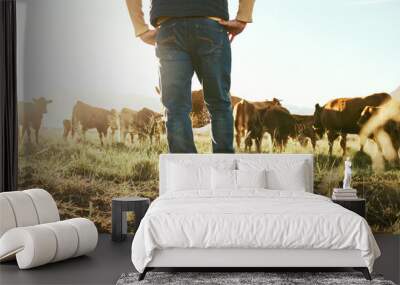 Cow, farmer and man on grass field in nature for meat, beef or cattle food industry. Closeup back view of farming livestock, cows and agriculture animals, milk production and management in sunshine Wall mural