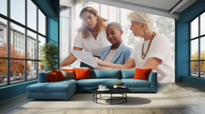 Discussion, documents and business women in meeting for planning, strategy and working on project. Teamwork, collaboration and female workers talking, brainstorming and in conversation with paperwork Wall mural