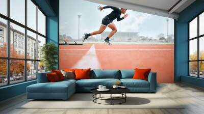 Man, athlete and ready for race on track with practice, training or exercise for competition. Black person, runner and fast with dedication, determination and passion on face with speed for sport Wall mural