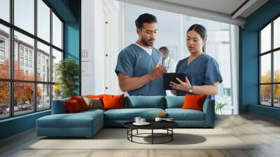 Medical advice, help and doctors with a tablet for healthcare, research and medicine planning. Communication, collaboration and men working in cardiology talking about surgery results on technology Wall mural