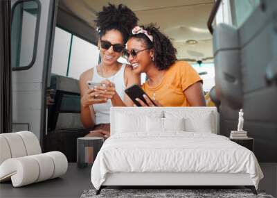 Black friends, phone and social media travel in communication together for road trip adventure. Happy and excited African American women sharing moments of traveling on mobile smartphone for vacation Wall mural