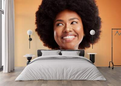 Black woman, african beauty and skincare health of luxury spa model with a smile on an orange studio background. Natural skin, healthy face and happy casual organic cosmetic afro hair treatment model Wall mural