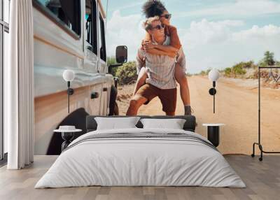 Couple piggy back on road trip travel in Australia, adventure in summer holiday and outdoor truck drive. Young happy people walking on path, fun vacation lifestyle together and transport Wall mural