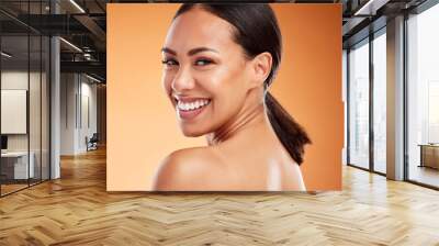 Face, beauty and skincare for woman with smile for facial health against a brown mockup studio background. Young model happy about natural wellness, clean teeth and dermatology with mock up space Wall mural