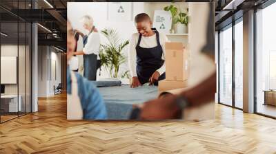 Fashion designer and creative stylist cutting fabric, sewing clothes and planning costume design in workshop. Smiling, happy and young woman in textile, clothing and manufacturing studio or factory Wall mural