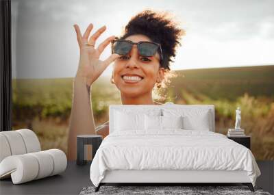 Young black woman, sunset portrait in field countryside and happy smile with summer sunglasses in Brazil. Outdoor adventure in nature, travel freedom on vacation and holiday .trip alone in sunshine Wall mural