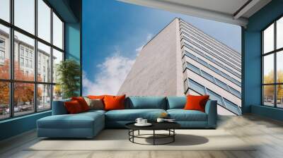 high-rise building and blue sky with soft clouds Wall mural