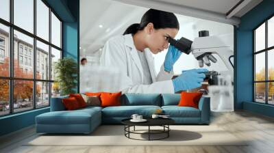 Woman, microscope and science in lab for chemistry, observation and experiment results. Scientist, tech and study at table for medicine engineering, pharmaceutical research and healthcare innovation Wall mural