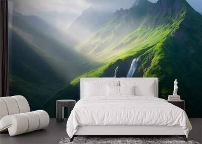 A mountain range with a waterfall and a bright sun shining on it  Wall mural