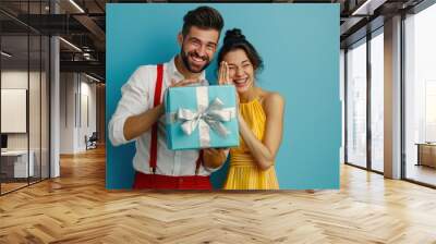 The happy couple with gift Wall mural