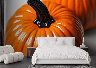 Two vibrant orange pumpkins displayed against a white backdrop for a festive halloween party decor Wall mural