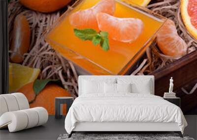 Creamy panna cotta and orange citrus jelly. Two layered dessert surrounded by fruits Wall mural