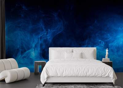 Abstract blue smoke moves on black background. Swirling smoke. Wall mural